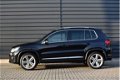 Volkswagen Tiguan - 1.4 TSI R-line Edition I Panoramadak I Xenon - Led | Trekhaak | Navi | Clima - 1 - Thumbnail