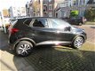 Renault Captur - 0.9 TCe Limited NL-AUTO Navigatie Airco Ecc Lichtm.velgen Parkeersensoren A - 1 - Thumbnail