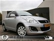 Suzuki Swift - 1.2 Bandit 5drs. Airco/Radio-Cd-Mp3/Isofix 100% Dealer-onderhouden - 1 - Thumbnail