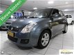 Suzuki Swift - 1.3 Comfort - 1 - Thumbnail