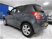 Suzuki Swift - 1.3 Comfort - 1 - Thumbnail