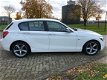 BMW 1-serie - 116i Business+ / Harman Kardon / PDC / Groot navi / Sport / 5 deurs - 1 - Thumbnail