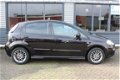 Fiat Punto Evo - 1.3 CLIMA CRUISE TREKHAAK DONKER GLAS 15''LM-VELGEN - 1 - Thumbnail