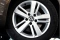 Volkswagen Touran - 1.2 TSI Highline BlueMotion NAVI CRUISE PDC STOELVERW. '12 - 1 - Thumbnail