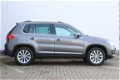 Volkswagen Tiguan - 1.4 TSI 160pk Sport&Style | Navigatie | Park assist + Parkeersensoren | Trekhaak - 1 - Thumbnail