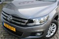 Volkswagen Tiguan - 1.4 TSI 160pk Sport&Style | Navigatie | Park assist + Parkeersensoren | Trekhaak - 1 - Thumbnail