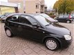 Opel Corsa - 1.2-16V Rhythm AUTOMAAT - 1 - Thumbnail