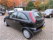 Opel Corsa - 1.2-16V Rhythm AUTOMAAT - 1 - Thumbnail