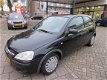 Opel Corsa - 1.2-16V Rhythm AUTOMAAT - 1 - Thumbnail