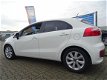 Kia Rio - 1.2I DYNAMICLINE 5DRS SLECHTS>29.000KM AC/NAV/CAMERA/CRUISE/LMV/MIST.LAMP - 1 - Thumbnail