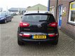 Kia Sportage - 2.0 X-ecutive Plus Pack met navigatie, trekhaak - 1 - Thumbnail