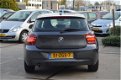 BMW 1-serie - 116i Upgrade Edition LEER | SPORTSTOELEN | NAVI | XENON | NAP - 1 - Thumbnail