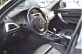 BMW 1-serie - 116i Upgrade Edition LEER | SPORTSTOELEN | NAVI | XENON | NAP - 1 - Thumbnail