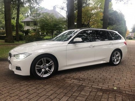 BMW 3-serie Touring - 330d High Executive M Styling/Panoramadak/Alcantara/NIEUWSTAAT/Inruil mogelijk - 1