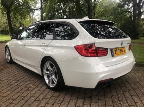 BMW 3-serie Touring - 330d High Executive M Styling/Panoramadak/Alcantara/NIEUWSTAAT/Inruil mogelijk - 1