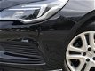 Opel Astra Sports Tourer - 1.0T 105PK Online Edition | Navigatie | Sensoren Voor + Achter | - 1 - Thumbnail