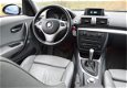 BMW 1-serie - 120i High Executive automaat / eerste eigenaar / navigatie / leer / glazen schuifdak / - 1 - Thumbnail