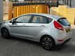 Ford Fiesta - 1.25 86 PK 5-drs - airco - LMV 16'' - Winterbanden - 1 - Thumbnail