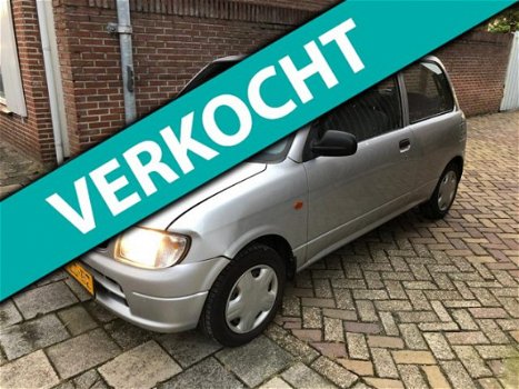 Daihatsu Cuore - 1.0-12V DVVT XTi rook uit uitlaat - 1