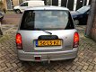 Daihatsu Cuore - 1.0-12V DVVT XTi rook uit uitlaat - 1 - Thumbnail