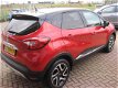 Renault Captur - 1.2 TCe Helly Hanson*AUTOMAAT*AIRCO NAVIGATIE*CRUISE CONTROL* ACHTERUITRIJCAMERA*PA - 1 - Thumbnail