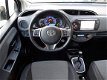 Toyota Yaris - 1.5 Hybrid Lease Automaat/Navi/Camera/Clima/Cruise control/Radio/Bluetooth/LM-velgen - 1 - Thumbnail