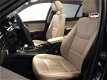 BMW 3-serie Touring - (J) 320i High Executive [ FM Navi Panoramdak Xenon Leder Clima Cruise ] - 1 - Thumbnail