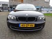 BMW 1-serie - 116i Business Line 5 deuren, Navi , Clima, isofix - 1 - Thumbnail