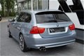 BMW 3-serie Touring - 325i High Exe Aut. Navi|Xenon|PDC|Cruis Blauw - 1 - Thumbnail