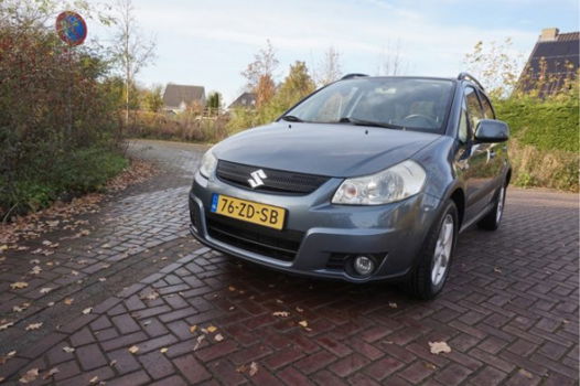 Suzuki SX4 - 1.6 SHOGUN 1E EIGENAAR NL AUTO AIRCO PARKEERSENSOREN AFN.TREKHAAK 16INCH LMV DAKRAILS R - 1