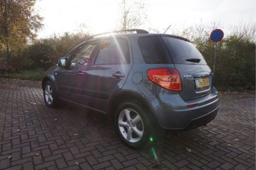 Suzuki SX4 - 1.6 SHOGUN 1E EIGENAAR NL AUTO AIRCO PARKEERSENSOREN AFN.TREKHAAK 16INCH LMV DAKRAILS R - 1