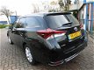 Toyota Auris Touring Sports - 1.8 Hybrid Lease PANORAMADAK / BTW AUTO / NAVI / NAP - 1 - Thumbnail