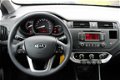 Kia Rio - 1.2 86pk Comfort Pack airco/start-stop/26.446km 5-drs - 1 - Thumbnail