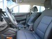 Hyundai Tucson - 1.6 GDi Comfort Navigatie / Parkeersensoren + Camera / Stoelverwarming - 1 - Thumbnail
