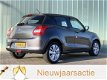 Suzuki Swift - 1.2 Comfort AIRCO/ BLUETOOTH CARKIT/ DAGRIJ VERLICHTING - 1 - Thumbnail