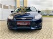 Ford Focus Wagon - 1.0 EcoBoost Titanium, ParkAssist, 2jaar APK - 1 - Thumbnail