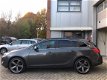 Opel Astra Sports Tourer - 1.4 Turbo Edition NAVI/PDC/DealerOH - 1 - Thumbnail