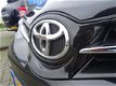 Toyota Auris - 1.6 VVT-I NOW 5DRS ECC/CRUISE/NAV/PARK.SENS/LMV/AFN.TREKHAAK - 1 - Thumbnail