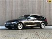 BMW 3-serie Touring - 318d High Executive 2013 Zwart - 1 - Thumbnail