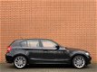 BMW 1-serie - 120i Business Line Sport | Airconditioning | Trekhaak | Cruise control | Parkeersensor - 1 - Thumbnail