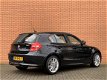 BMW 1-serie - 120i Business Line Sport | Airconditioning | Trekhaak | Cruise control | Parkeersensor - 1 - Thumbnail