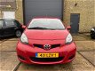 Toyota Aygo - 1.0-12V Aspiration Red Bj.2010 / 5Drs / airco / Lm-velgen - 1 - Thumbnail