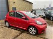 Toyota Aygo - 1.0-12V Aspiration Red Bj.2010 / 5Drs / airco / Lm-velgen - 1 - Thumbnail