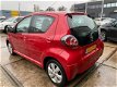 Toyota Aygo - 1.0-12V Aspiration Red Bj.2010 / 5Drs / airco / Lm-velgen - 1 - Thumbnail