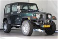 Jeep Wrangler - 4.0 I Hardtop / Youngtimer / Verhoogd - 1 - Thumbnail