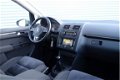 Volkswagen Touran - 1.2 TSI Highline BlueMotion Navigatie, Climate, Cruise, PDC, Trekhaak - 1 - Thumbnail