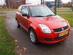 Suzuki Swift - 1.3 Base lm velgen met 4 seizoen banden - 1 - Thumbnail