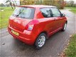 Suzuki Swift - 1.3 Base lm velgen met 4 seizoen banden - 1 - Thumbnail