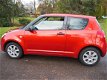 Suzuki Swift - 1.3 Base lm velgen met 4 seizoen banden - 1 - Thumbnail