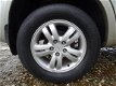 Hyundai Tucson - 2.0i Style | Clima + Cruise nu € 3.975, - 1 - Thumbnail